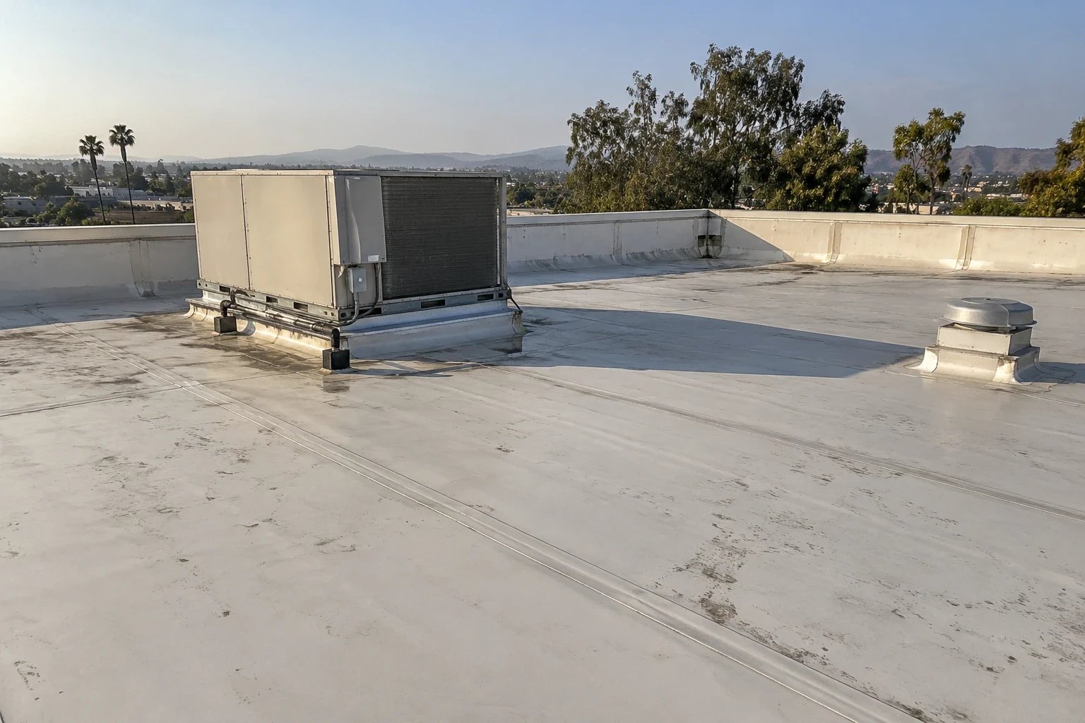 Crew installing a single-ply membrane