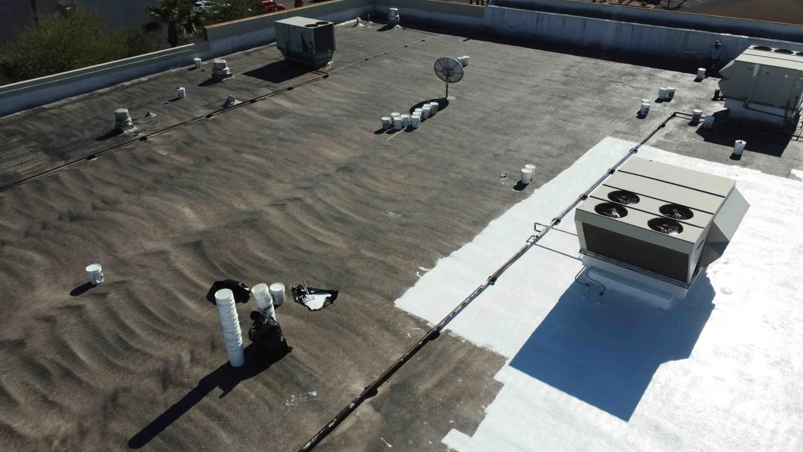 Commercial roof replacement crew on a Torrance low-slope roof